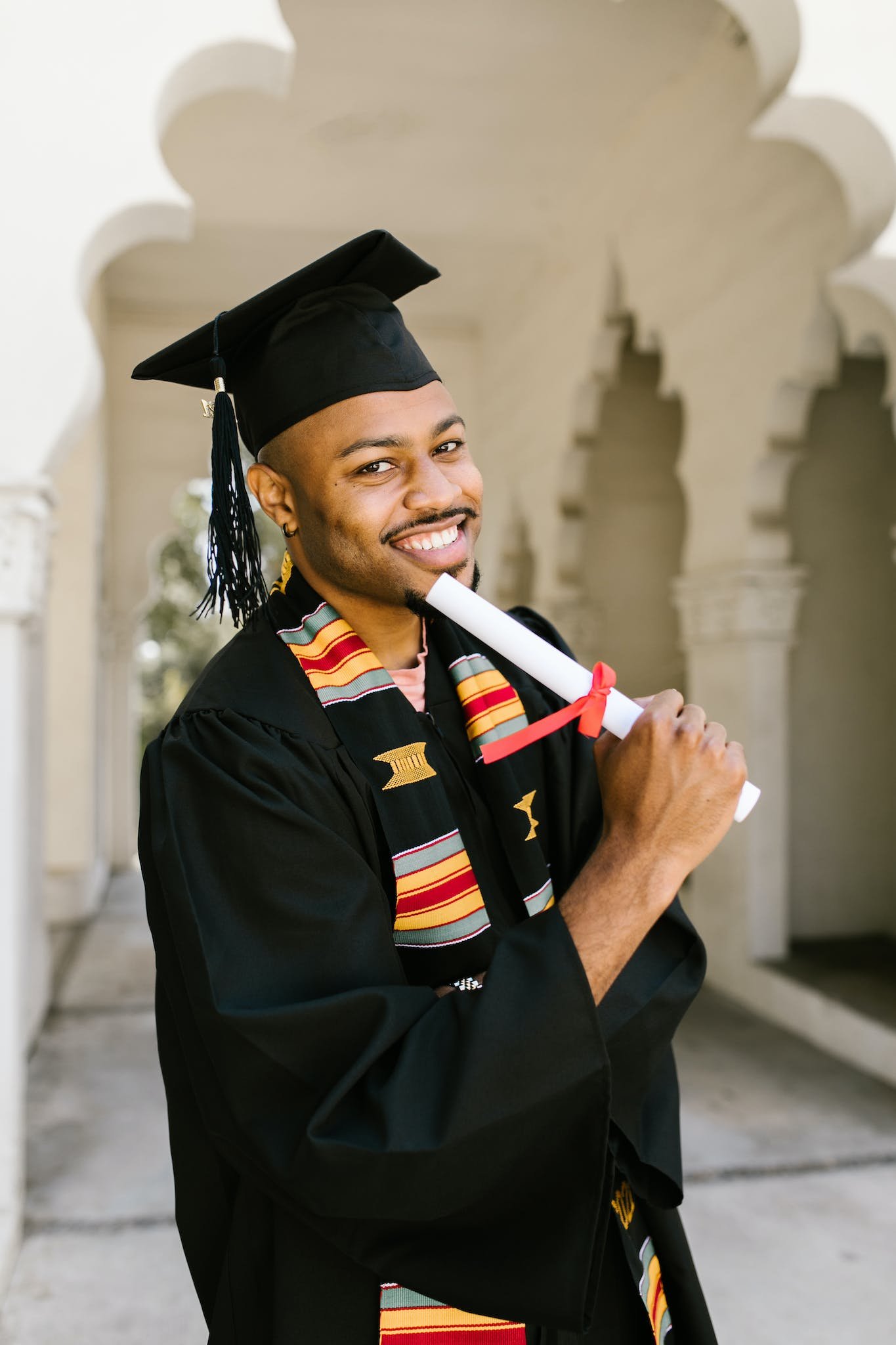 Man in Academic Dress and Mortar Board to show recovery coaching certification