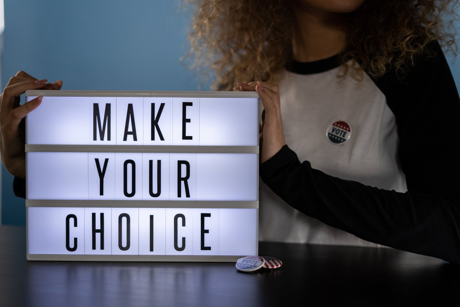 Woman With a Sign signifying Choosing A Recovery Coach